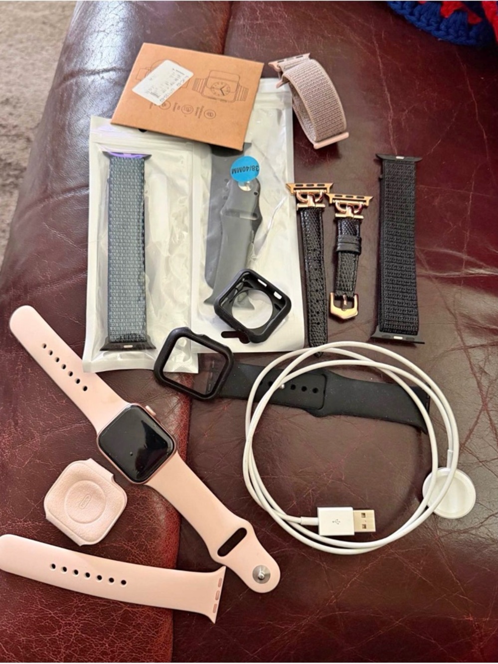 Apple Smartwatch with Pink and Black Bands and Accessories